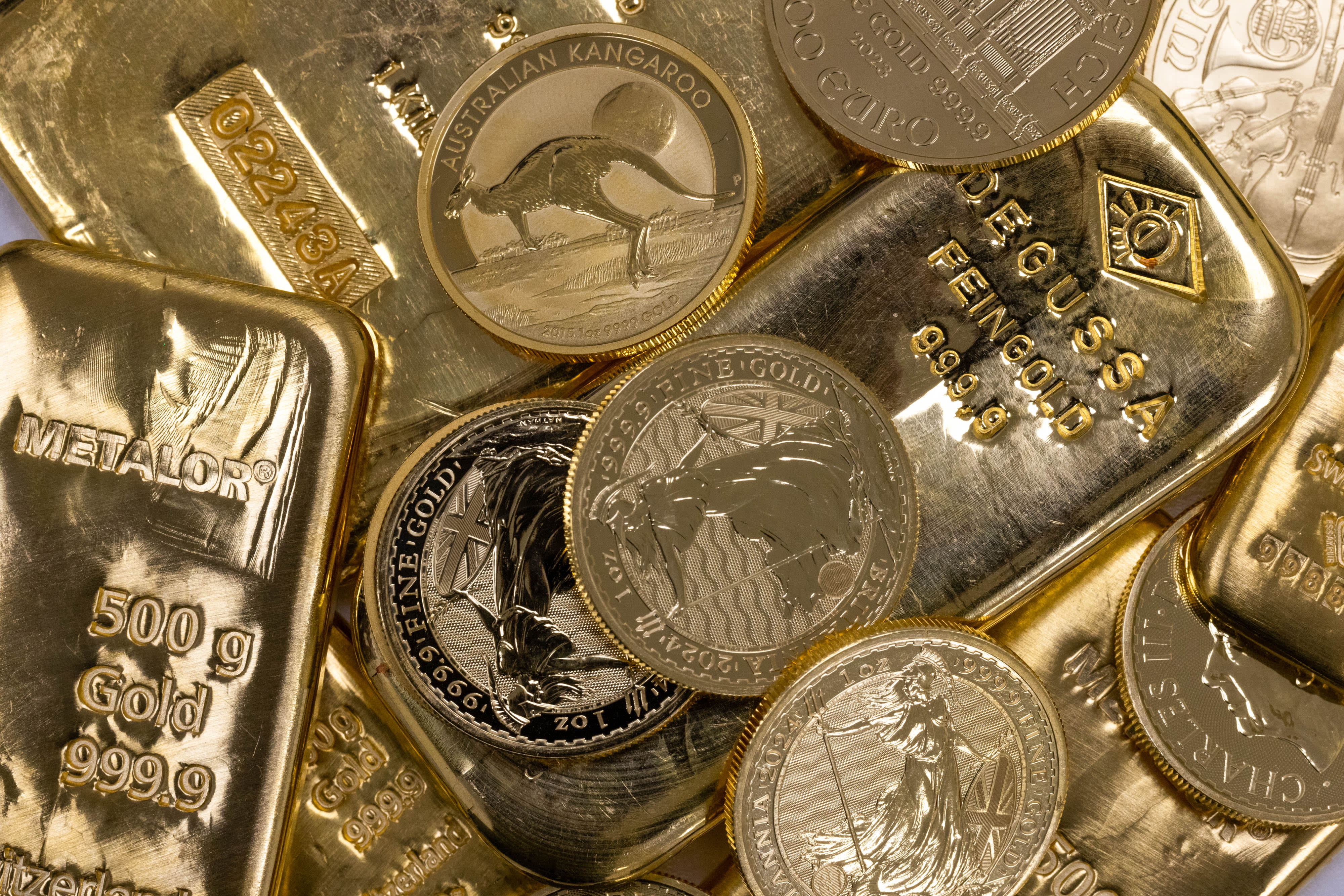A selection of gold bars and one-ounce gold coins at Gold Investments Ltd. bullion dealers in London on May 21, 2024.